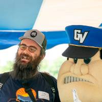Luke Larabee '15 taking pictures with Louie